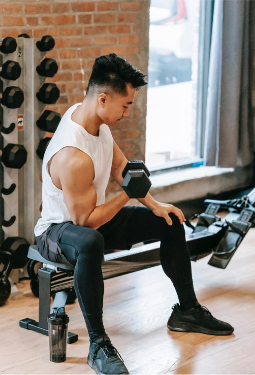 Man doing seated biceps curls